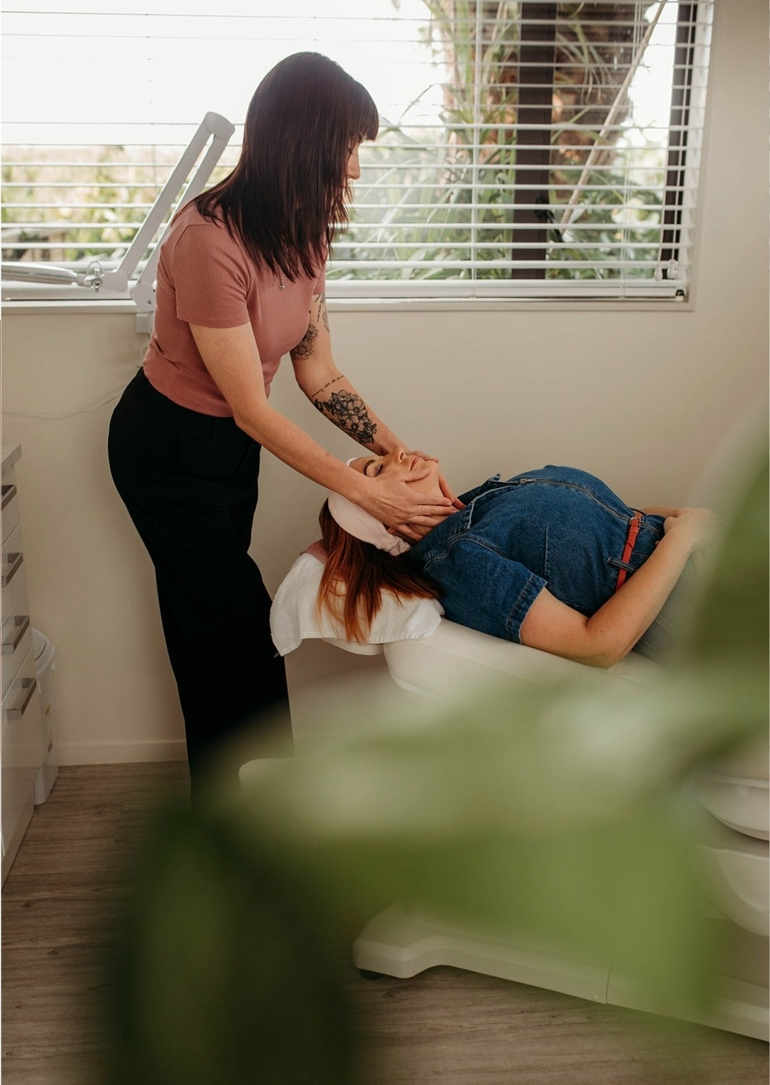 Facial treatment at McQuarrie Skin & Beauty in Havelock North. Michelle, beauty therapist performing a relaxing facial massage on a client in a calm, natural-light treatment room.